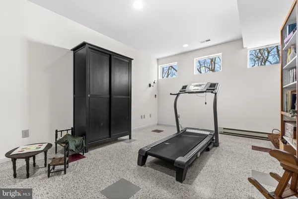 a living room with furniture a table and a flat screen tv