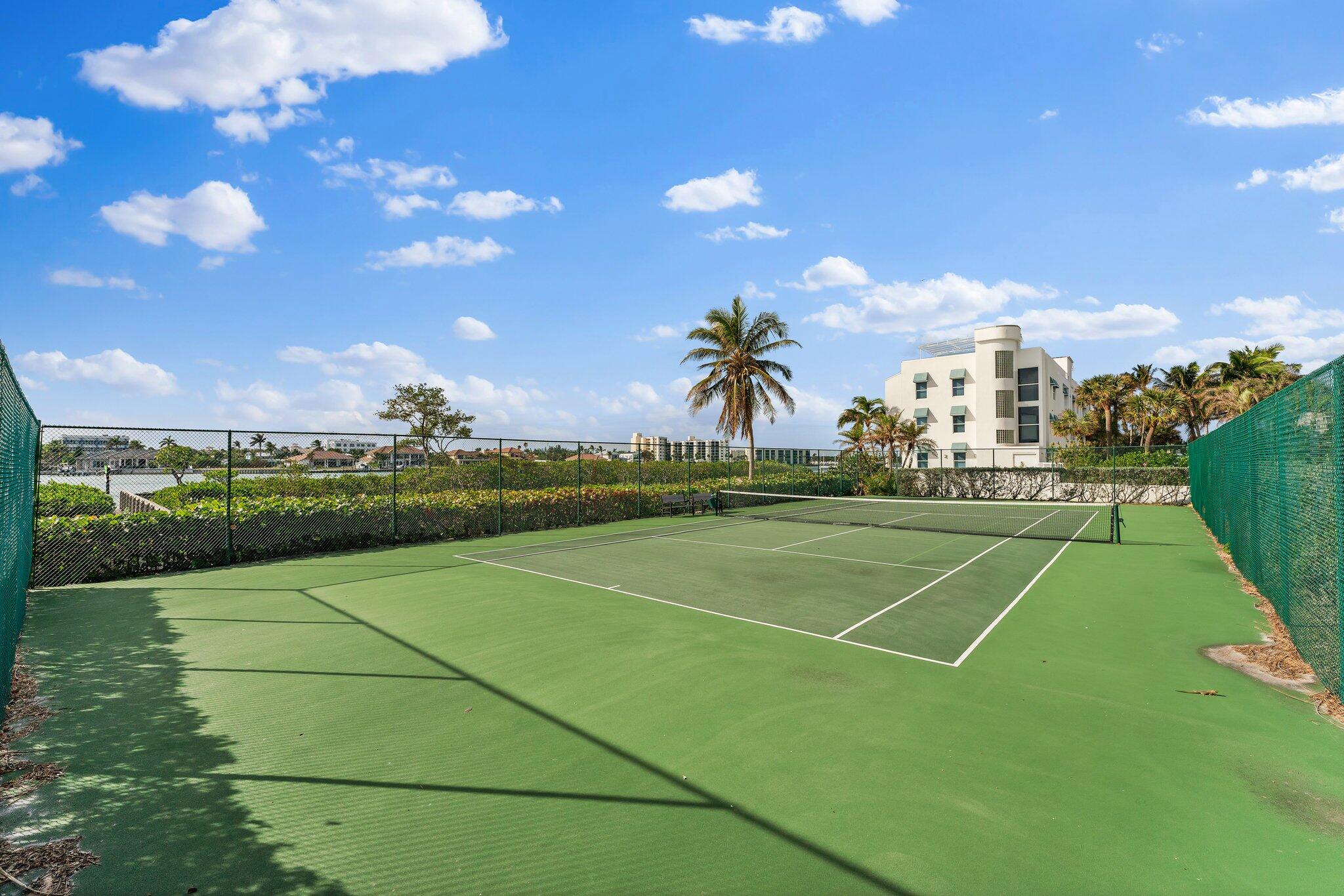 19670 South Beach Road, Unit B303 Jupiter, FL 33469 - Photo 59 of 104 a view of an outdoor space and tennis court
