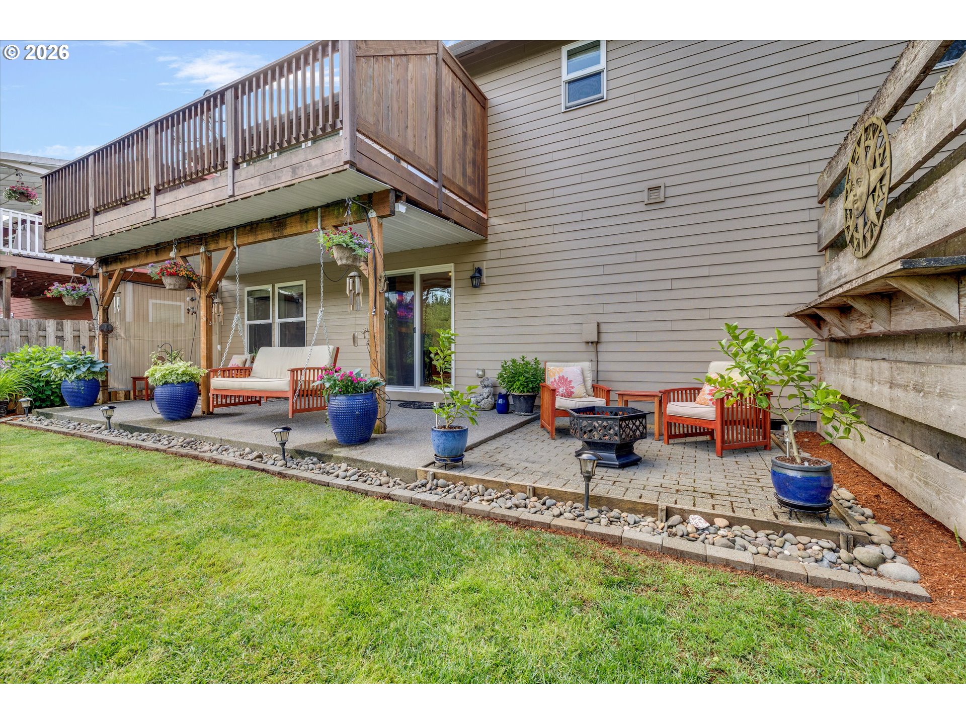 3769 10th Street Hubbard, OR 97032 - Photo 42 of 47 a view of a house with backyard sitting area and garden