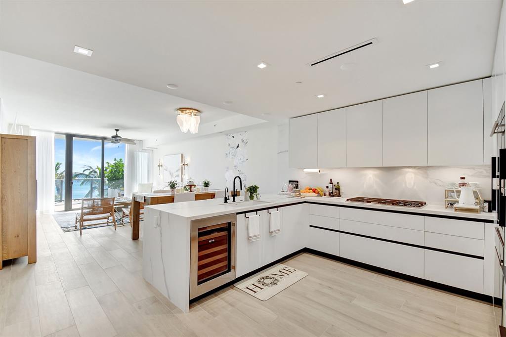 a kitchen with stove a sink and cabinets