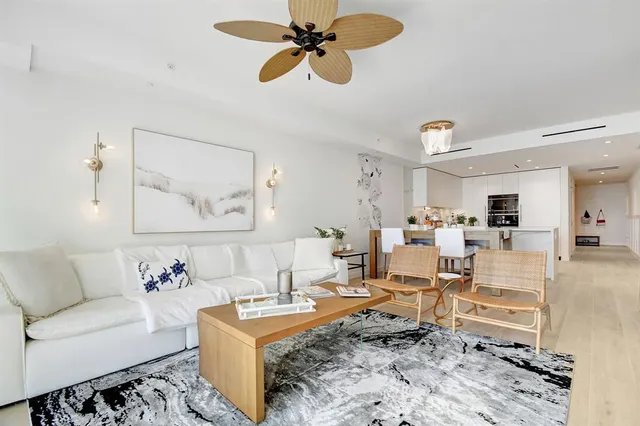 a living room with furniture and a rug