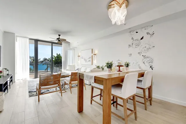 a view of a dining room with furniture window and outside view