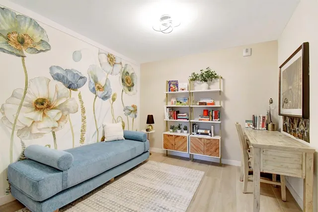 a dining room with furniture and window