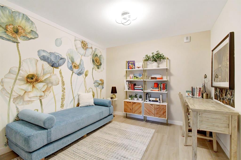 1116 North Ocean Boulevard, Unit 303 Pompano Beach, FL 33062 - Photo 29 of 52 a living room with furniture and a flat screen tv