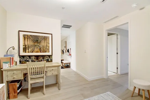 a room with furniture a rug and a window