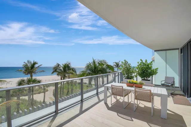a view of a chairs and table in patio