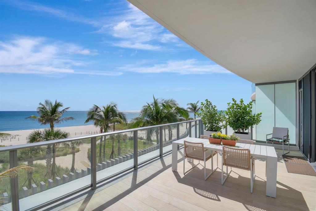1116 North Ocean Boulevard, Unit 303 Pompano Beach, FL 33062 - Photo 4 of 52 a view of a chairs and table in patio