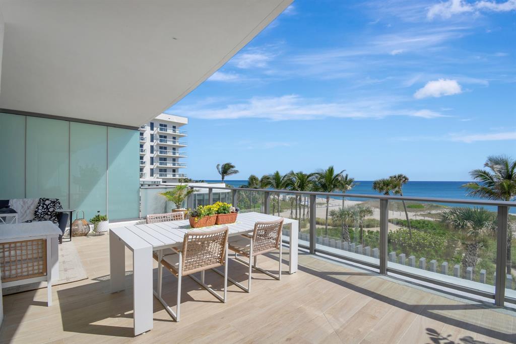 1116 North Ocean Boulevard, Unit 303 Pompano Beach, FL 33062 - Photo 5 of 52 a view of a terrace with furniture and outdoor view