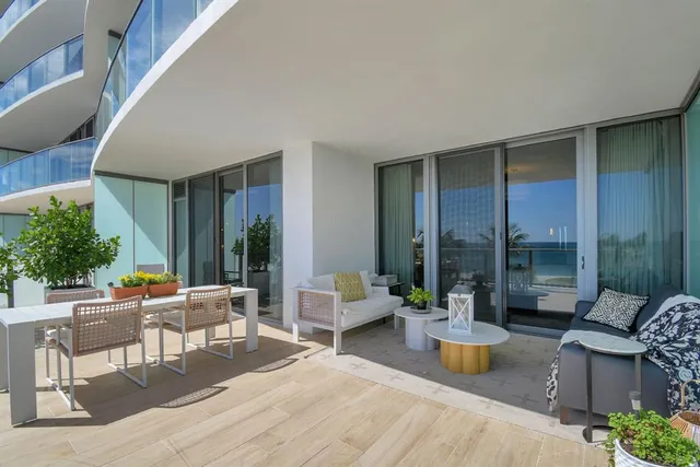 a outdoor space with patio the couches and potted plants