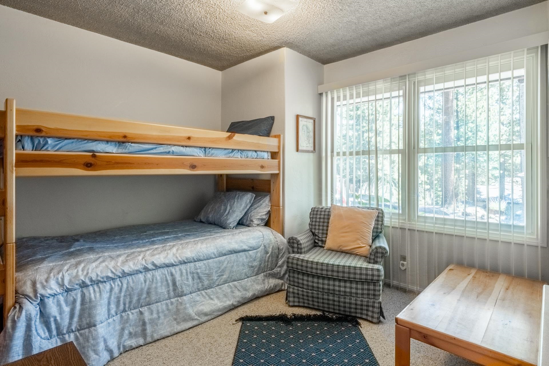 50 Hidden Valley Road, Unit 17 Mammoth Lakes, CA 93546 - Photo 24 of 40 Room with a light wood bunk bed, neutral carpeting, and a dual window system with vertical blinds