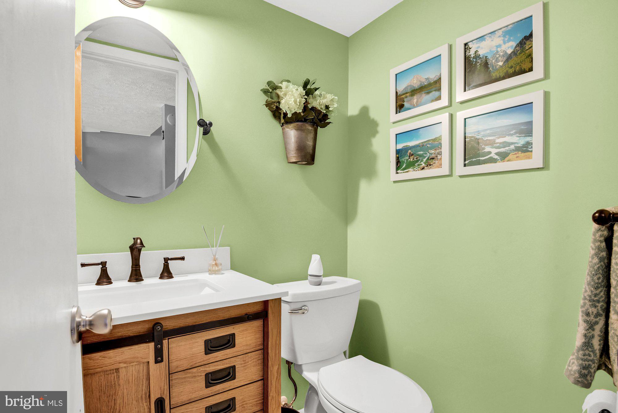 806 Uniontown Road Westminster, MD 21158 - Photo 10 of 10 a bathroom with a toilet a sink and mirror