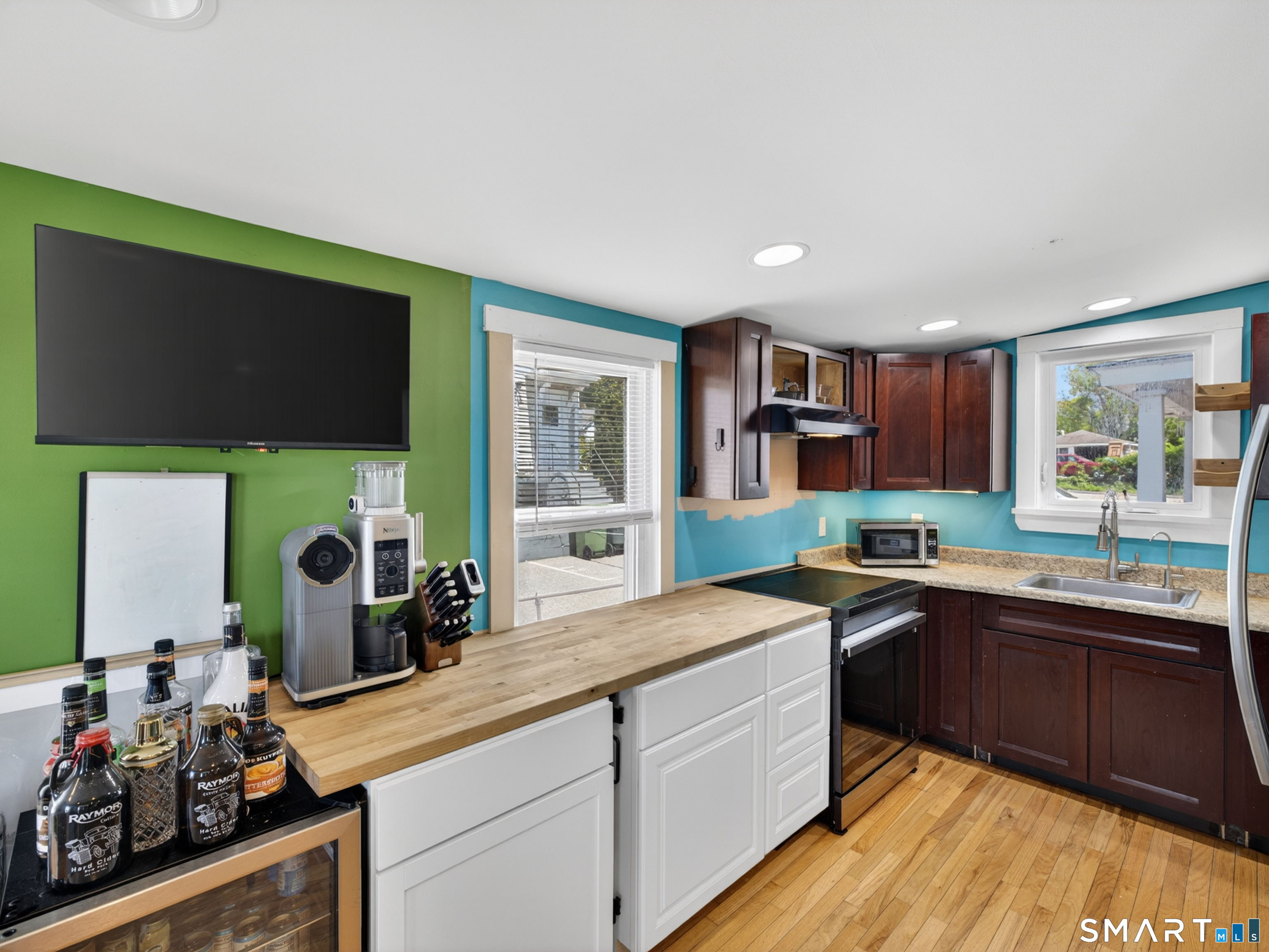 13 Oak Street Groton, CT 06340 - Photo 16 of 38 a kitchen with a sink stove and cabinets