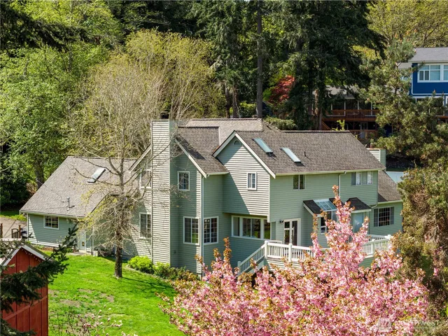 aerial view of a house with a big yard and potted plants