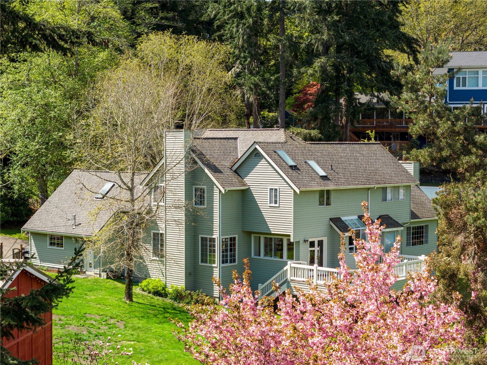 aerial view of a house with a big yard and potted plants