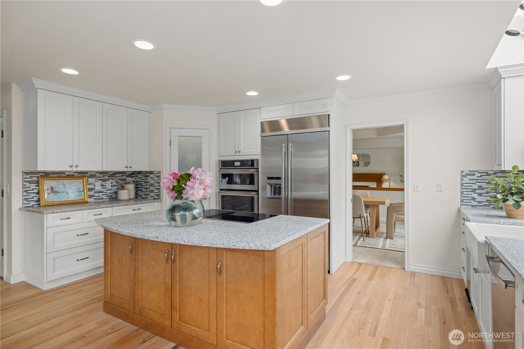8484 Northeast County Park Road Bainbridge Island, WA 98110 - Photo 17 of 35 a kitchen with stainless steel appliances granite countertop a refrigerator sink and cabinets