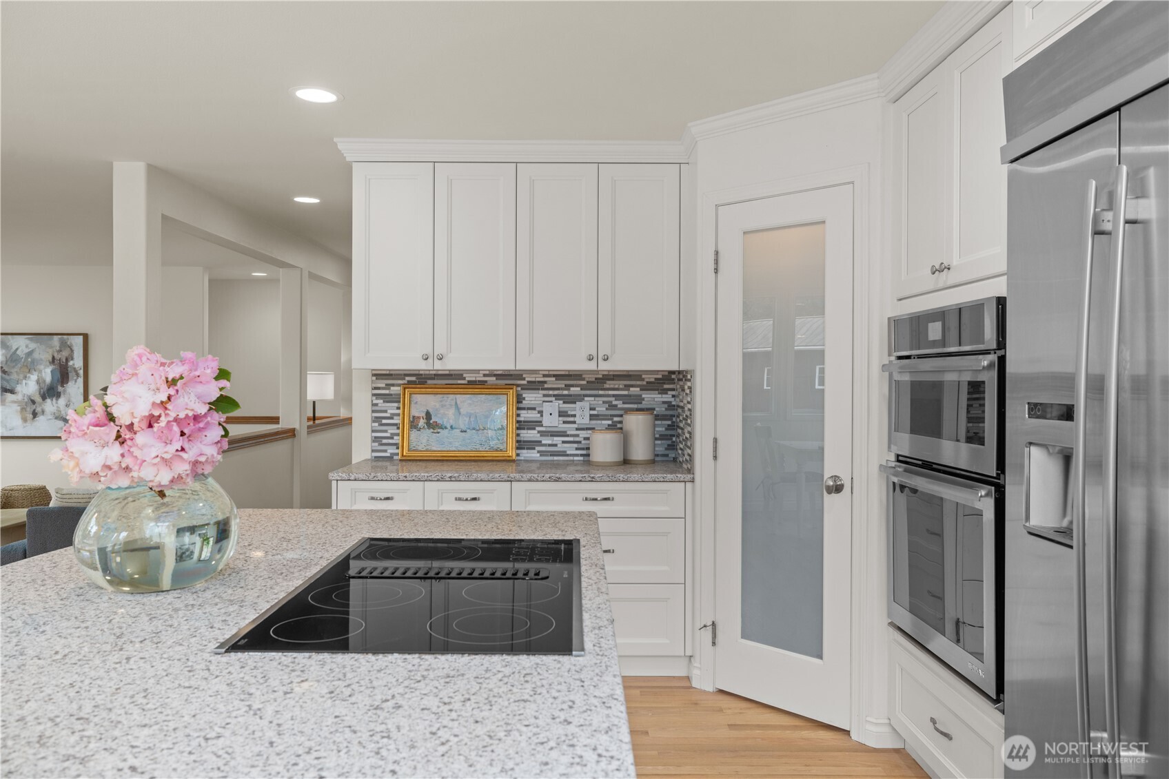 8484 Northeast County Park Road Bainbridge Island, WA 98110 - Photo 18 of 35 a kitchen with granite countertop a refrigerator and a stove