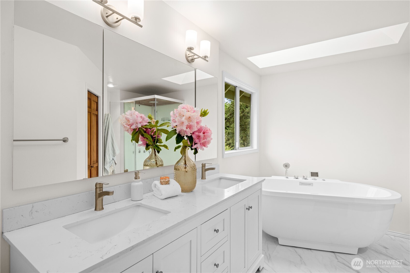 8484 Northeast County Park Road Bainbridge Island, WA 98110 - Photo 21 of 35 a bathroom with a sink and a mirror