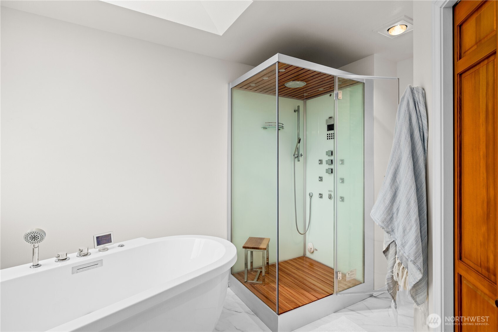 8484 Northeast County Park Road Bainbridge Island, WA 98110 - Photo 22 of 35 a bathroom with a shower and a sink