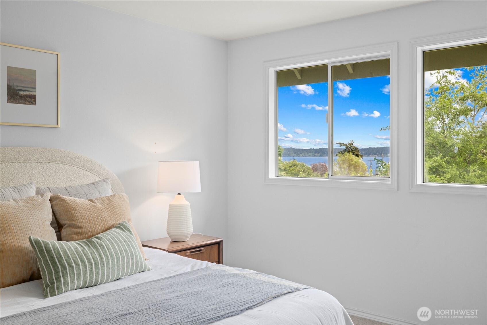 8484 Northeast County Park Road Bainbridge Island, WA 98110 - Photo 24 of 35 a bedroom with a bed and balcony