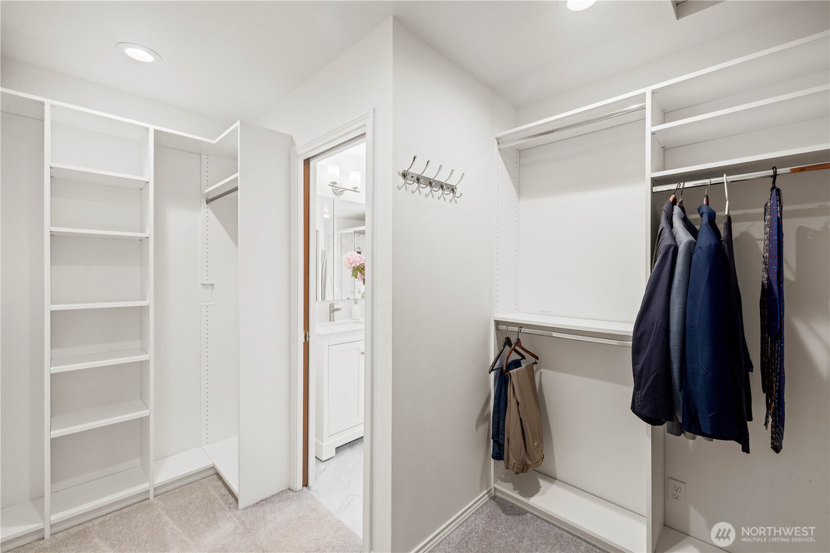 8484 Northeast County Park Road Bainbridge Island, WA 98110 - Photo 25 of 35 a view of walk in closet with clothes and shoes