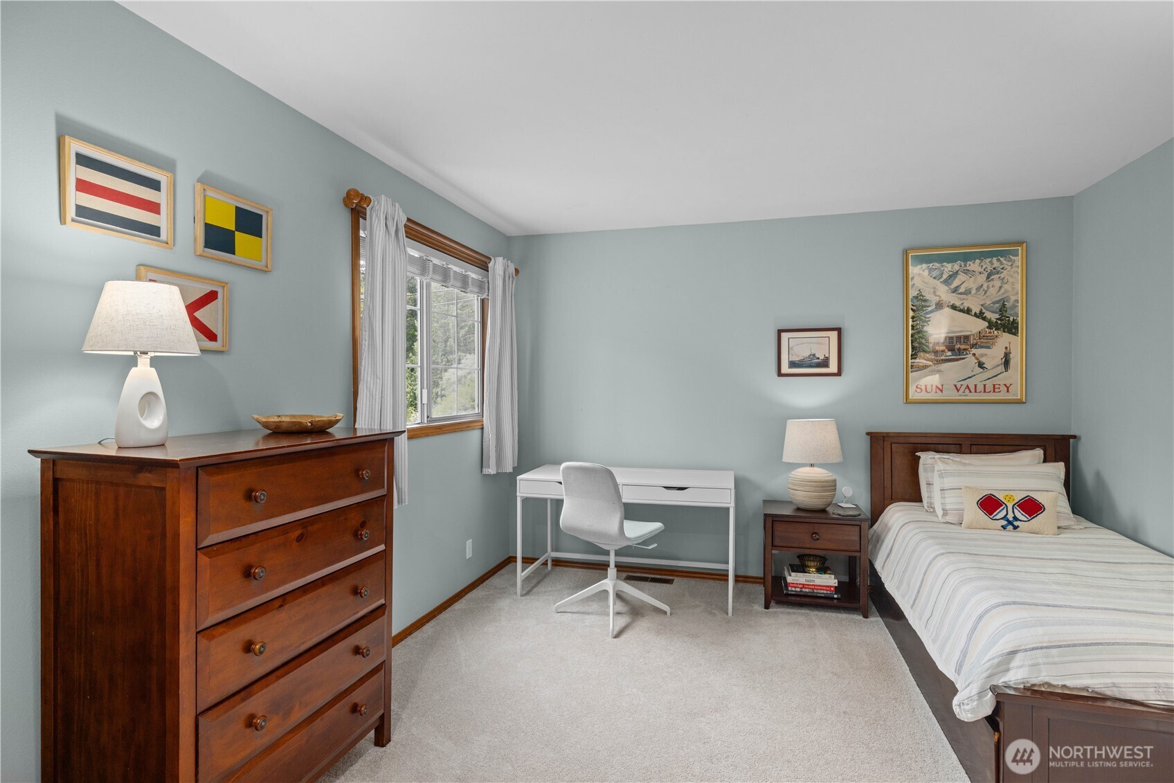 8484 Northeast County Park Road Bainbridge Island, WA 98110 - Photo 26 of 35 a bedroom with a bed and a dresser in it