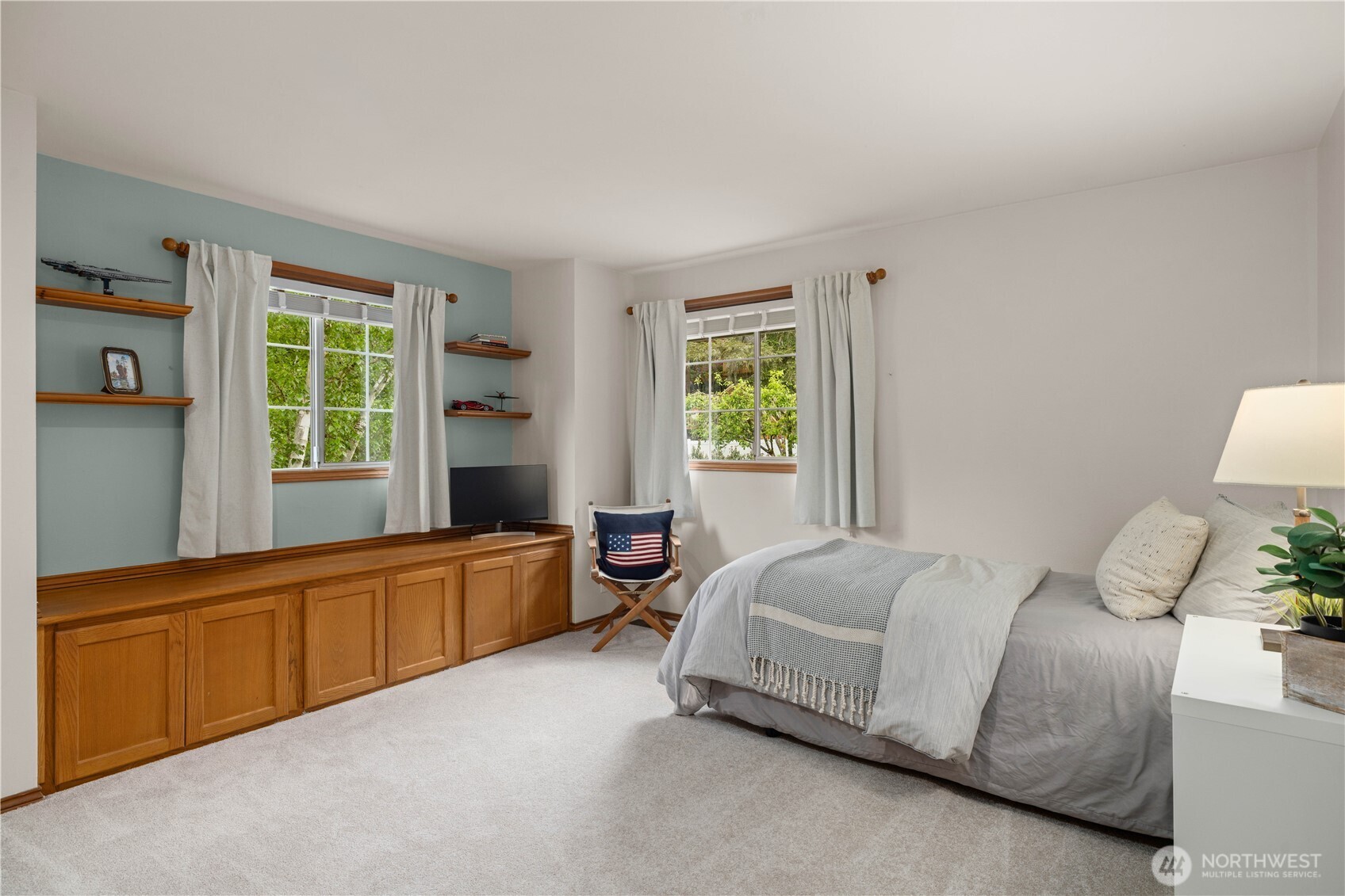 8484 Northeast County Park Road Bainbridge Island, WA 98110 - Photo 27 of 35 a bedroom with a bed and a window