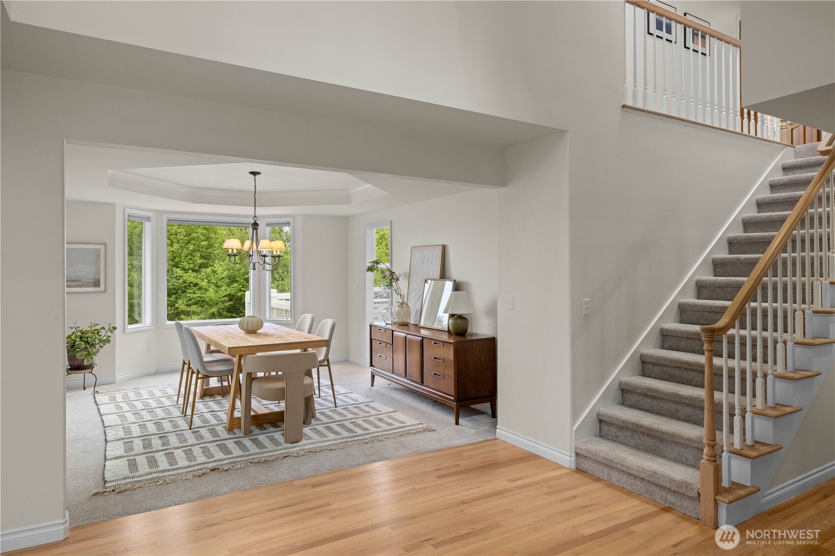 8484 Northeast County Park Road Bainbridge Island, WA 98110 - Photo 10 of 35 a view of a dining room with furniture window and wooden floor