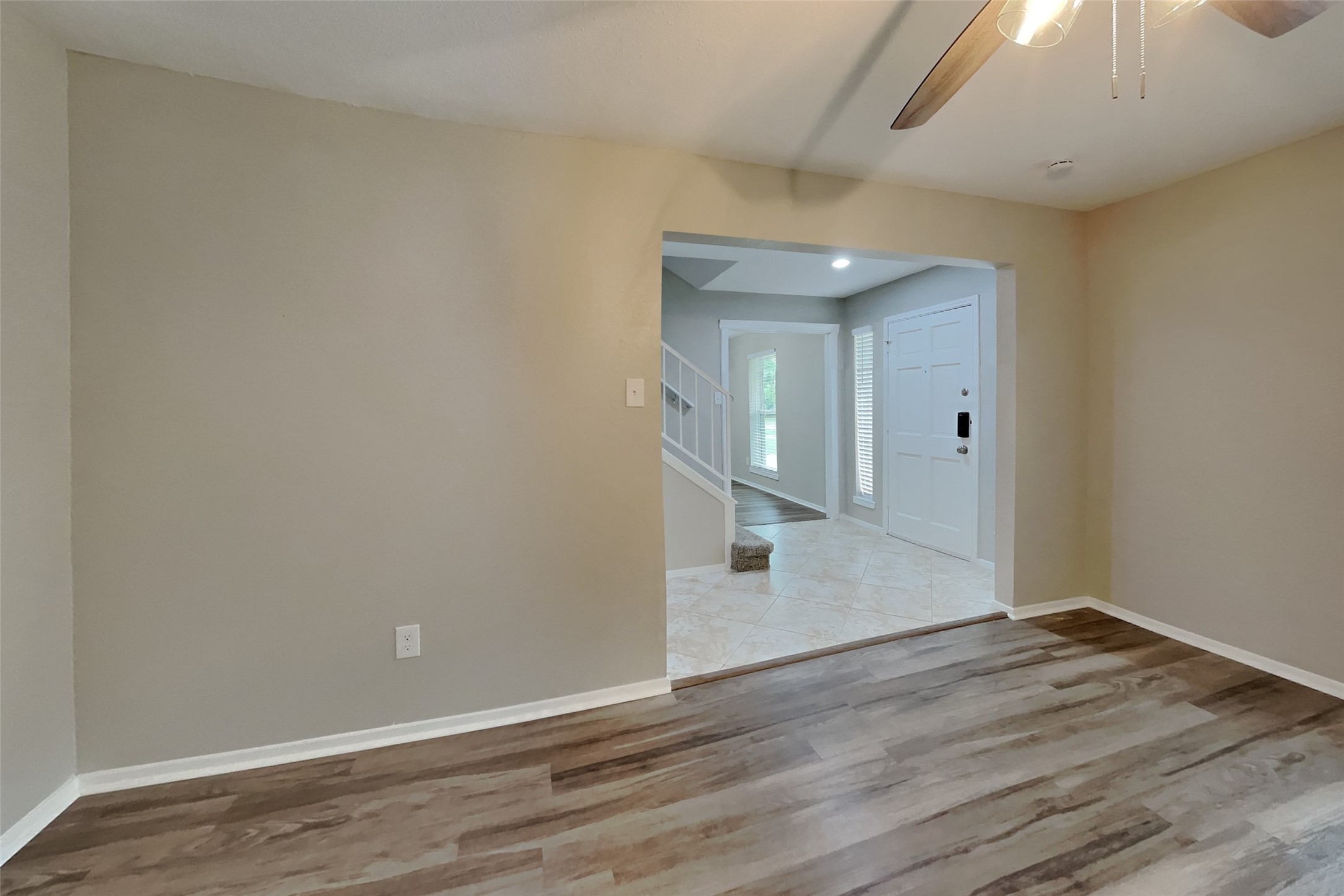 10015 Rippling Fields Drive Houston, TX 77064 - Photo 2 of 24 a view of a hallway with wooden floor