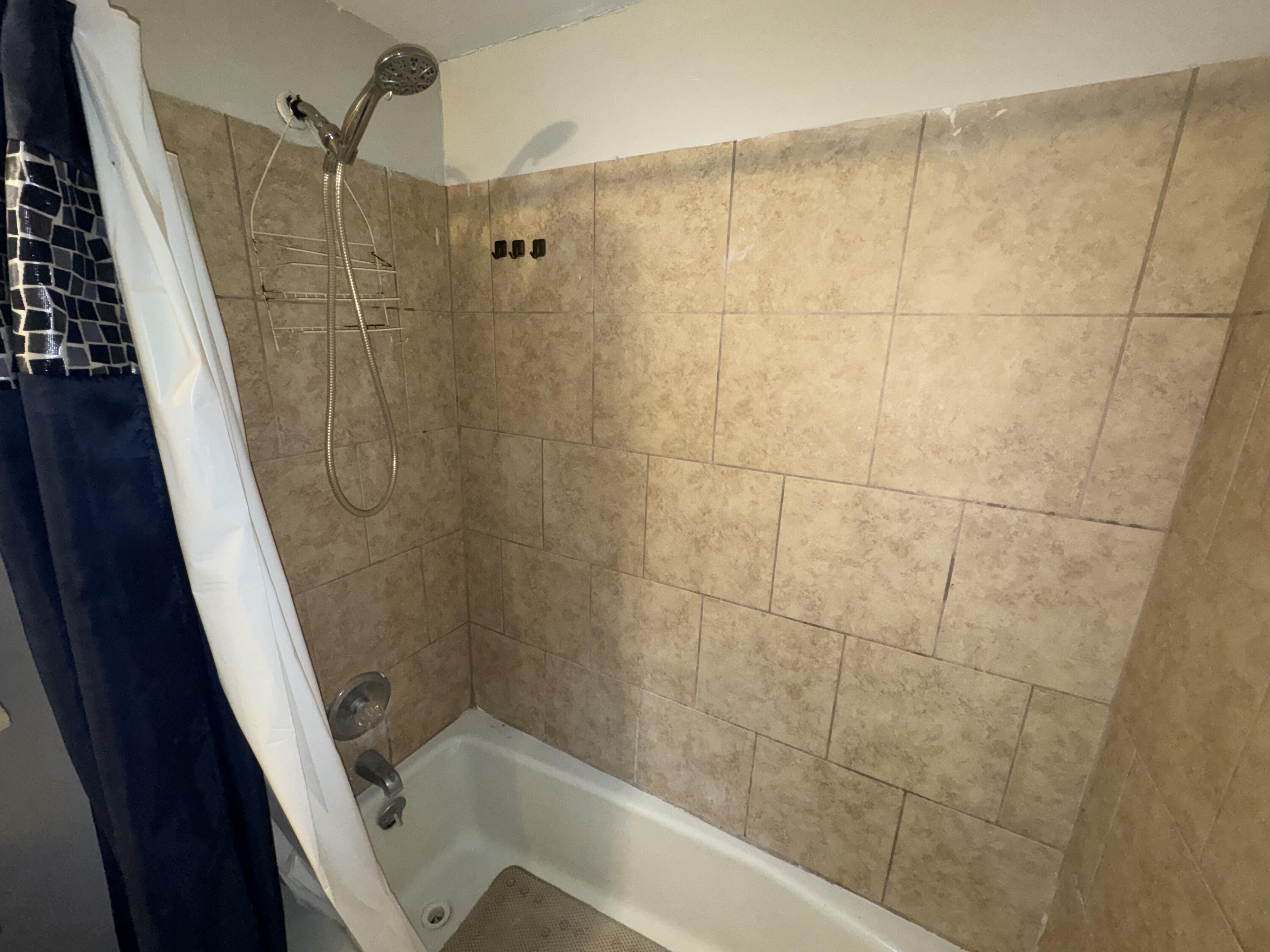 103 Pecos Place Plainview, TX 79072 - Photo 18 of 27 a bathroom with a shower and a sink