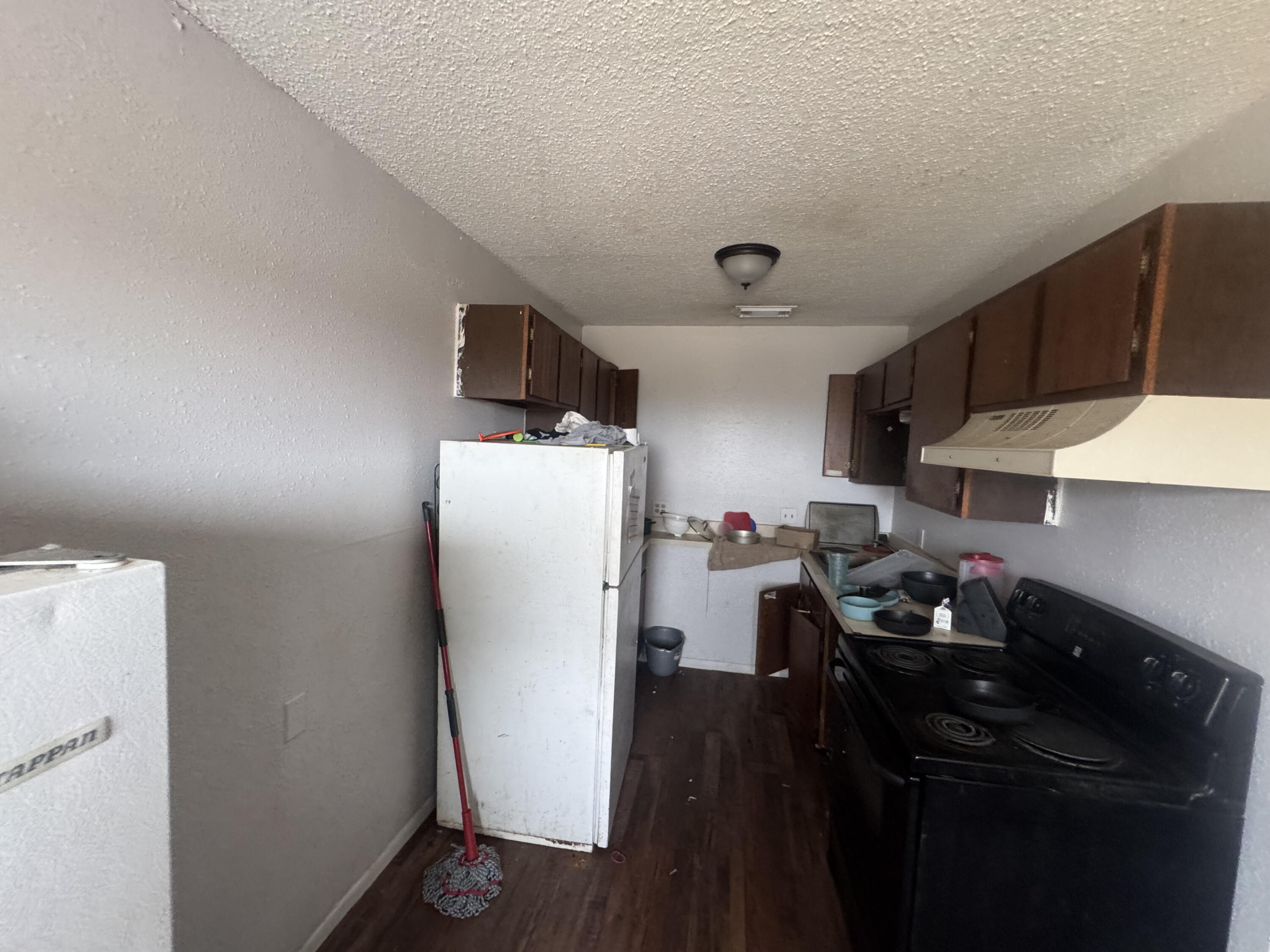 103 Pecos Place Plainview, TX 79072 - Photo 6 of 27 a kitchen with a sink and cabinets