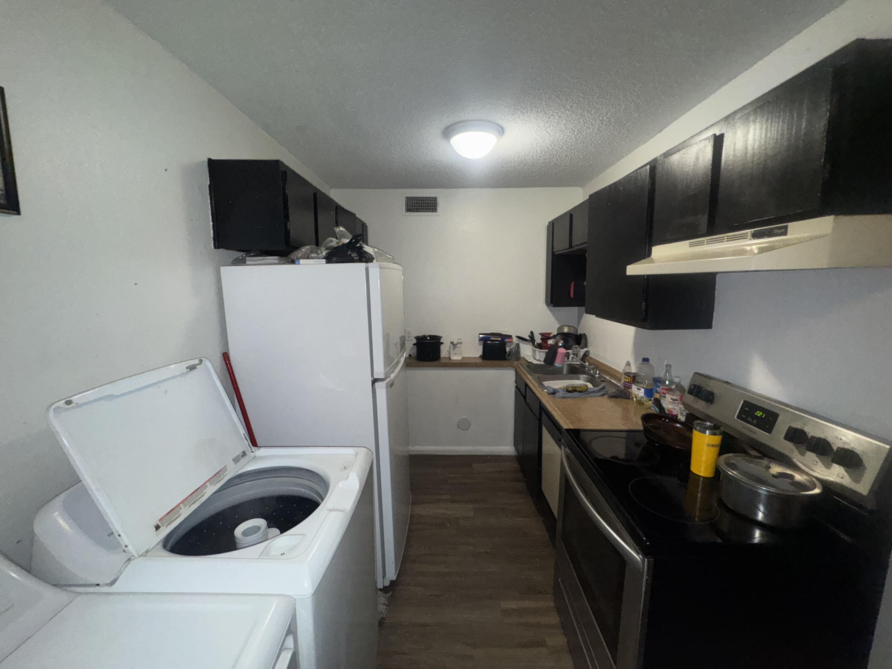 103 Pecos Place Plainview, TX 79072 - Photo 7 of 27 a kitchen with a sink a stove and refrigerator