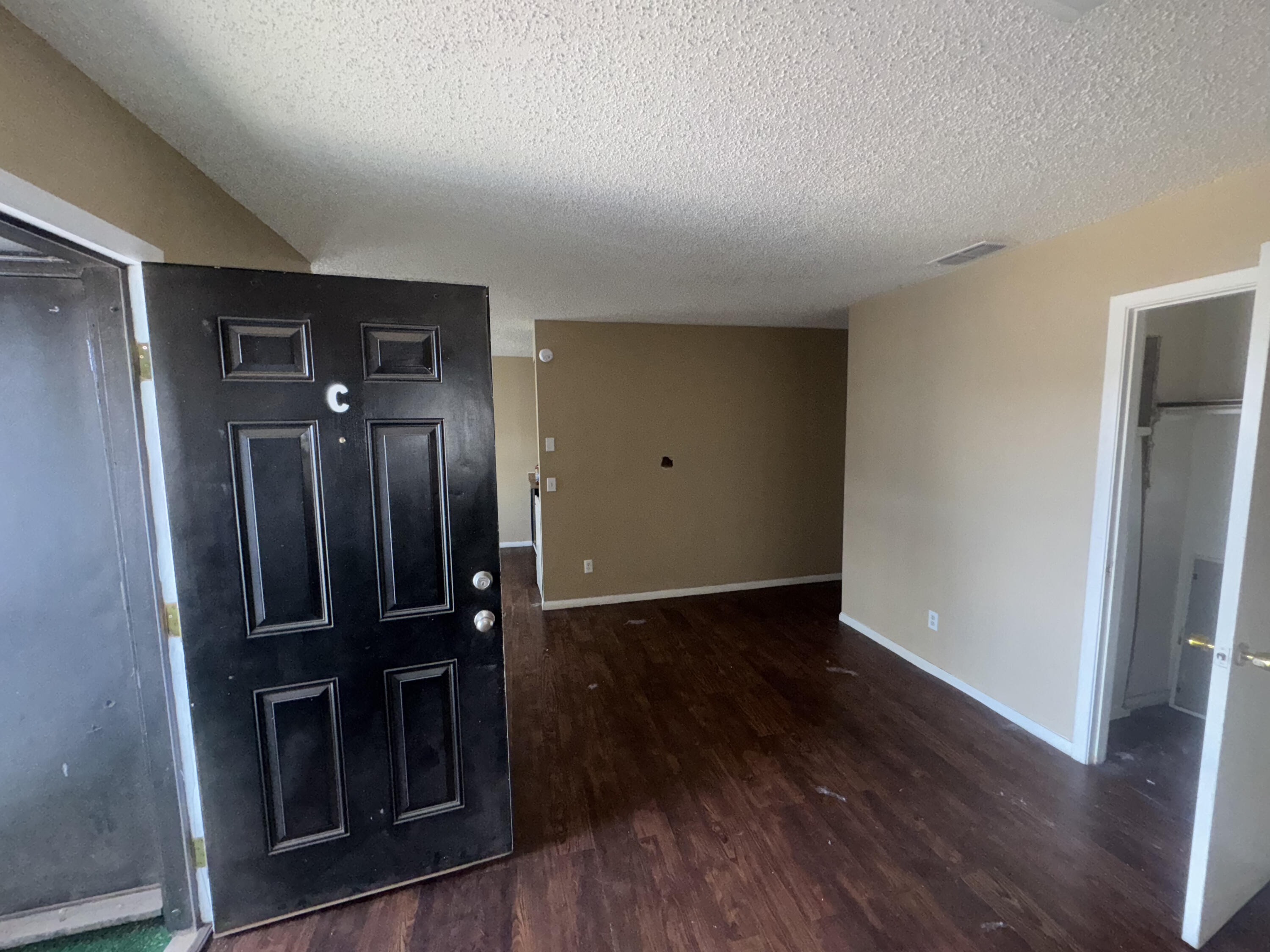103 Pecos Place Plainview, TX 79072 - Photo 10 of 27 wooden floor in an empty room