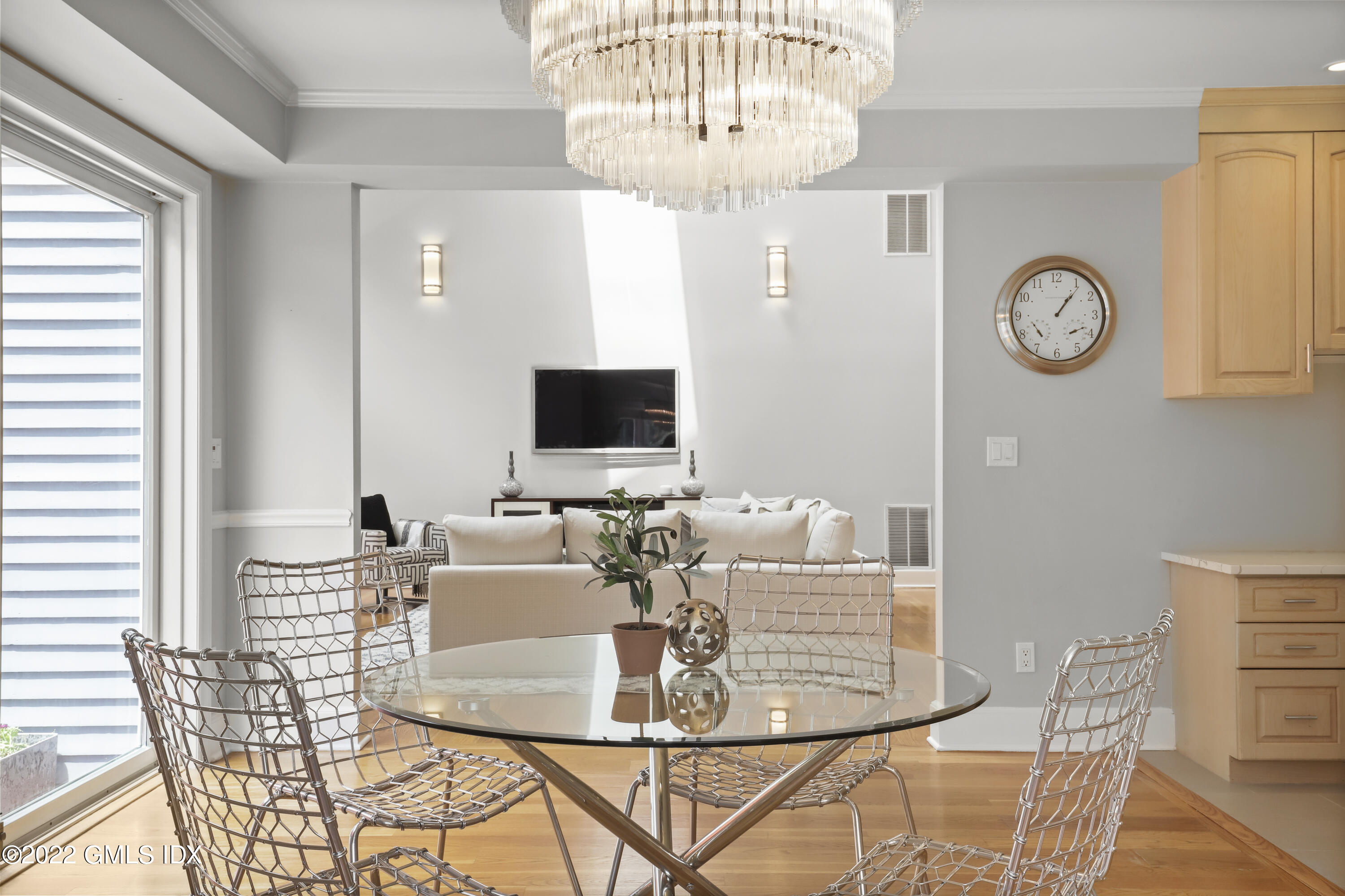 4 Juniper Hill Road Greenwich, CT 06830 - Photo 17 of 54 a view of a dining room with furniture and a chandelier