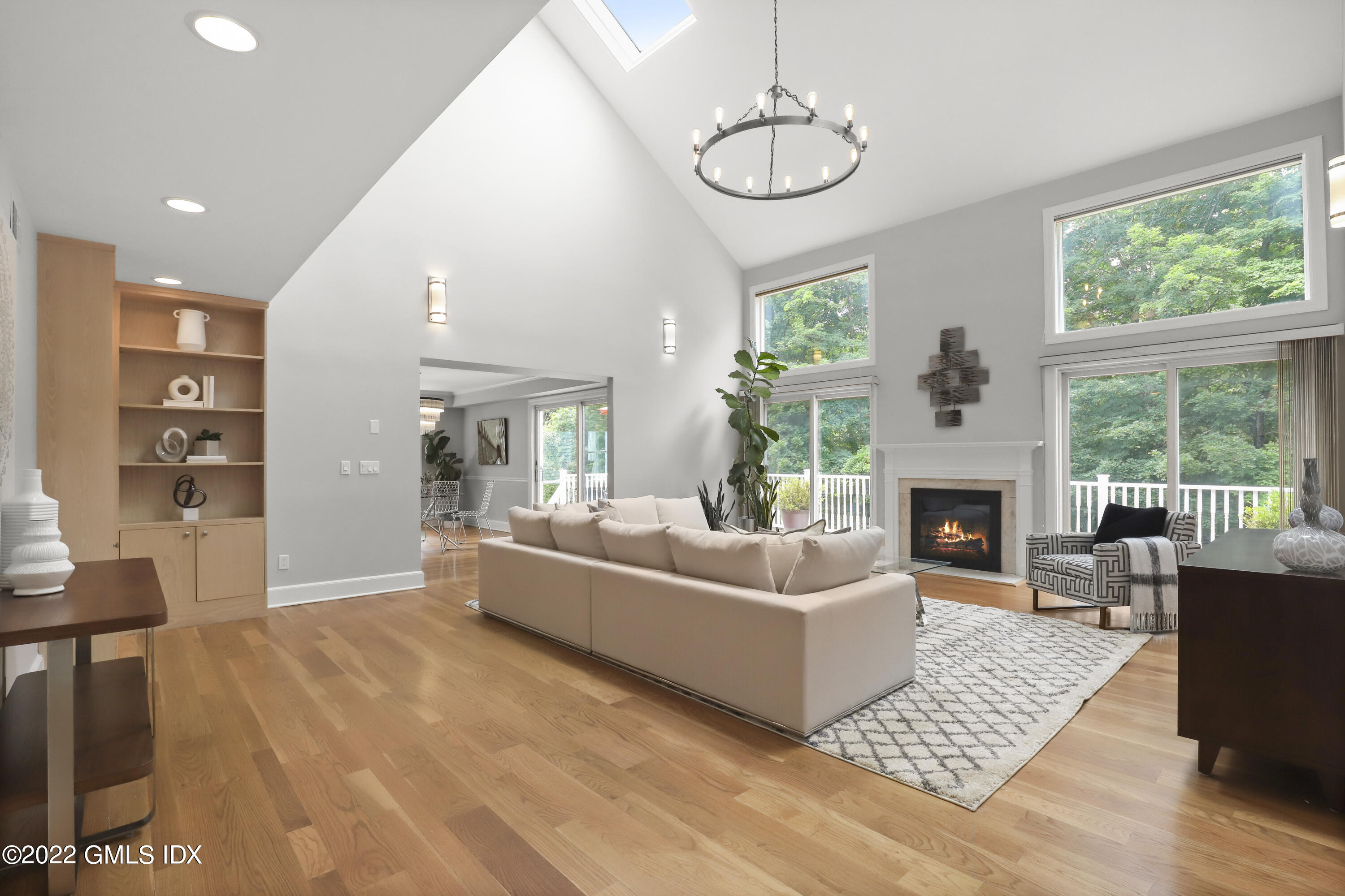 4 Juniper Hill Road Greenwich, CT 06830 - Photo 20 of 54 a living room with furniture a fireplace and a table