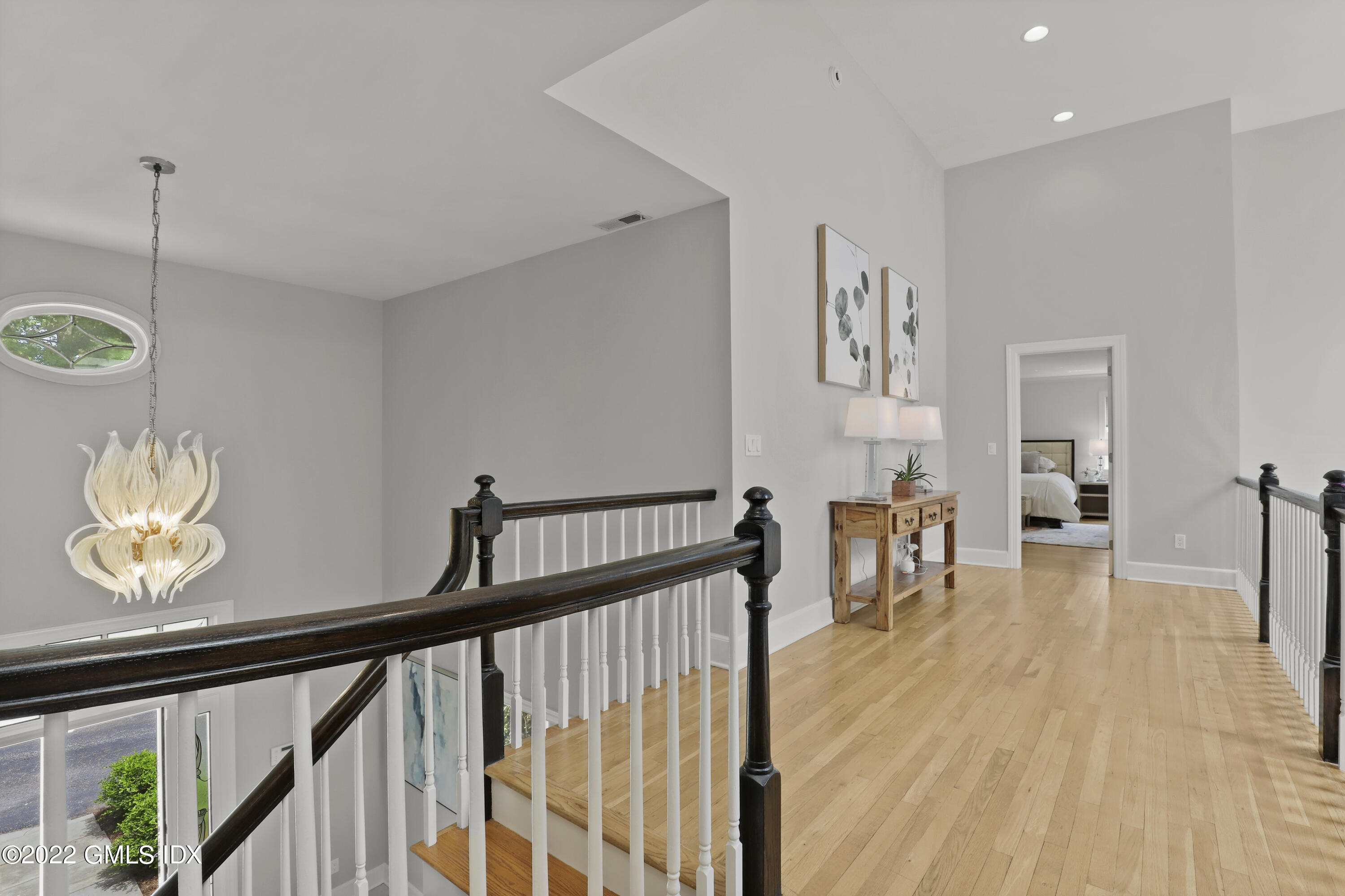 4 Juniper Hill Road Greenwich, CT 06830 - Photo 23 of 54 a view of a hallway with a dining table chairs and couches