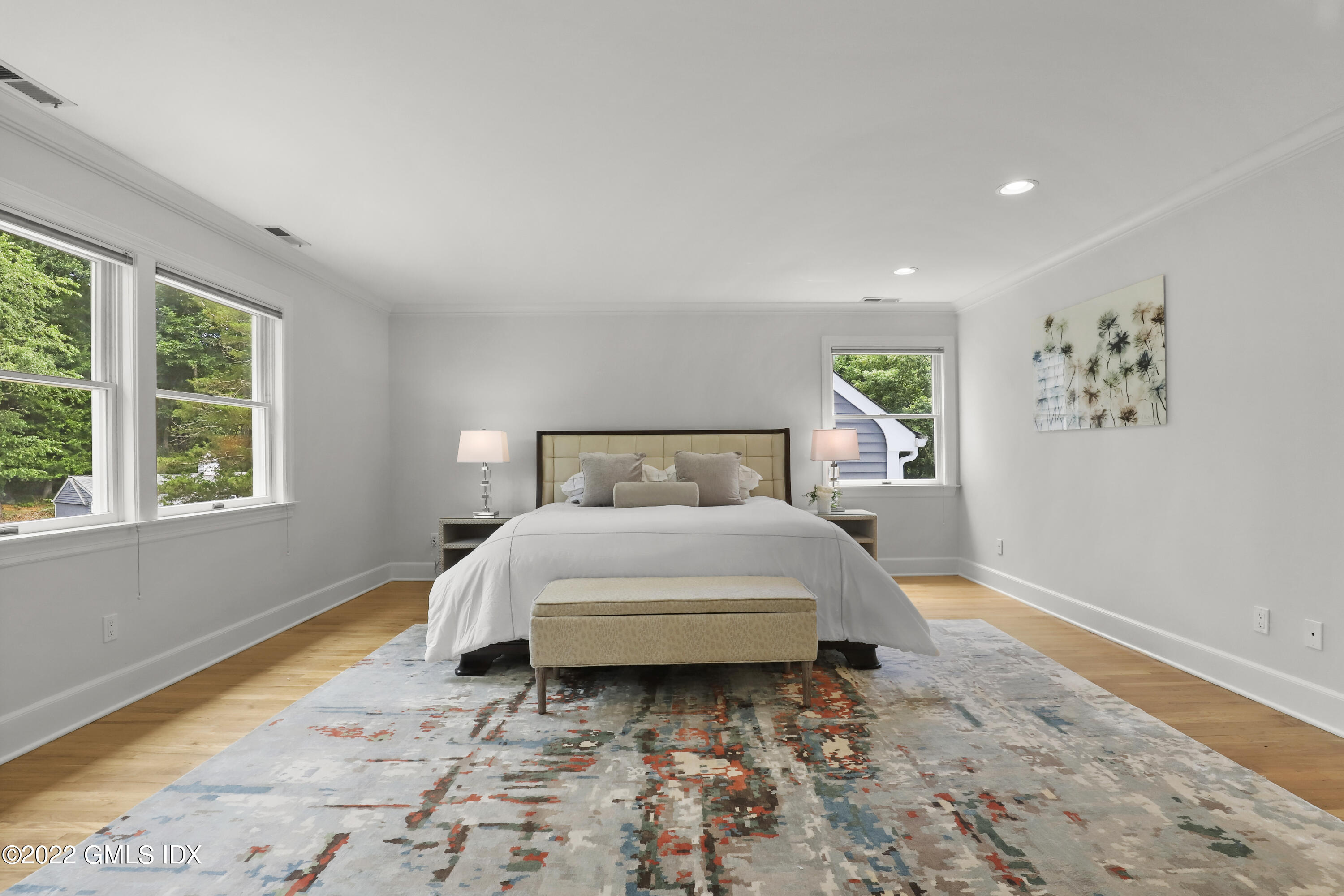 4 Juniper Hill Road Greenwich, CT 06830 - Photo 24 of 54 a bed sitting in a bedroom next to a window