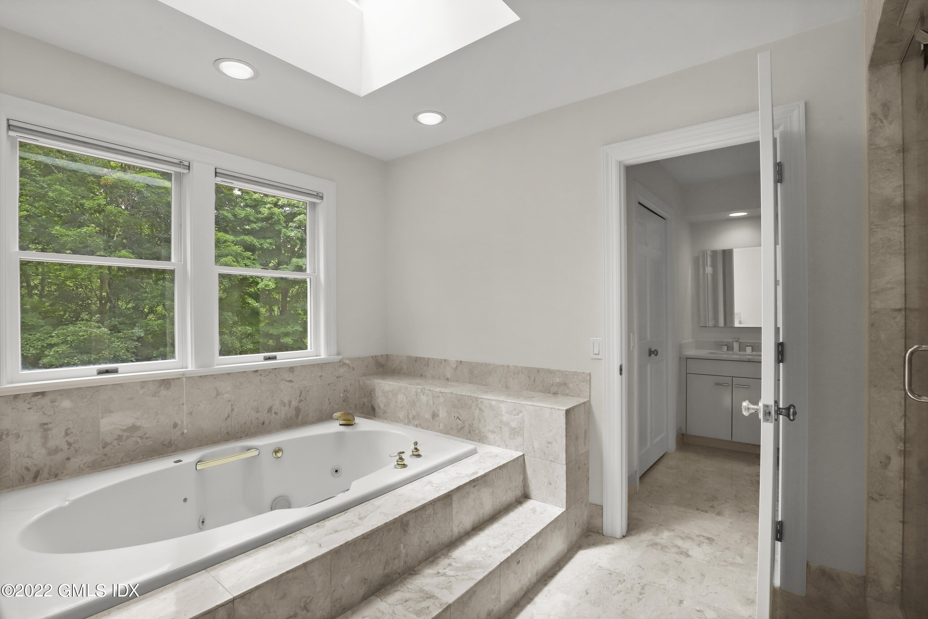 4 Juniper Hill Road Greenwich, CT 06830 - Photo 27 of 54 a bathroom with a bathtub and a sink