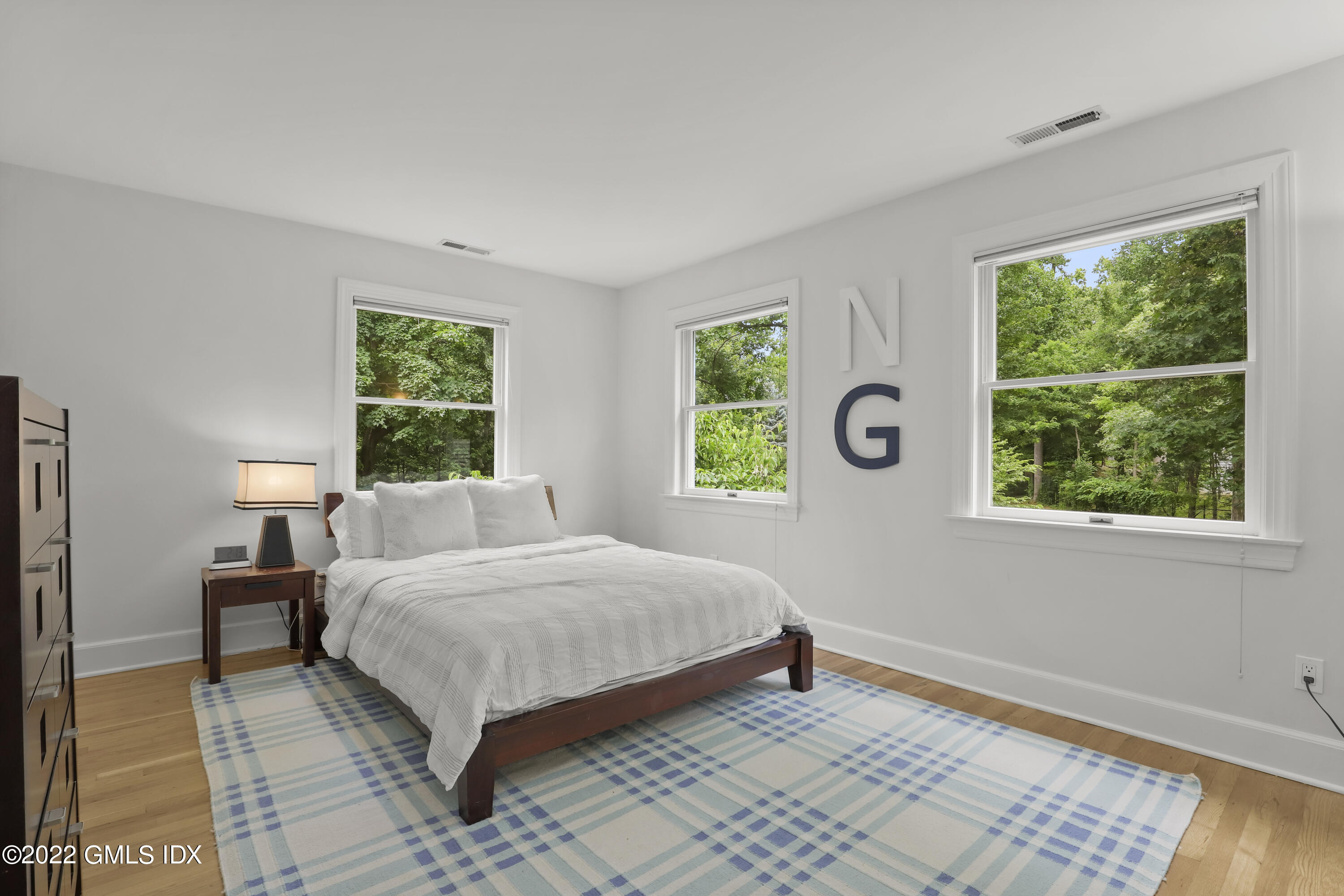 4 Juniper Hill Road Greenwich, CT 06830 - Photo 30 of 54 a bedroom with a bed and a window