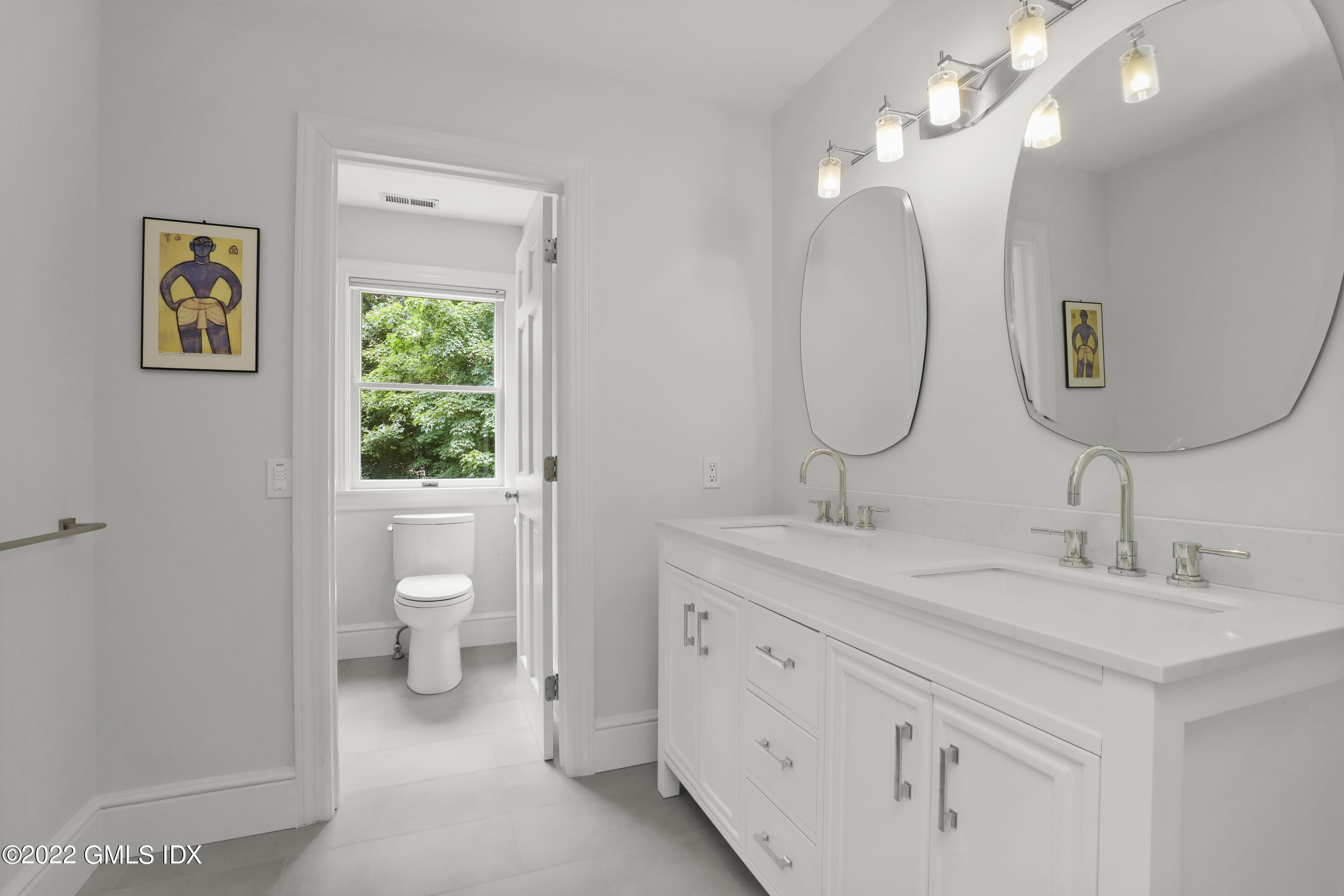 4 Juniper Hill Road Greenwich, CT 06830 - Photo 31 of 54 a bathroom with a toilet a sink and mirror
