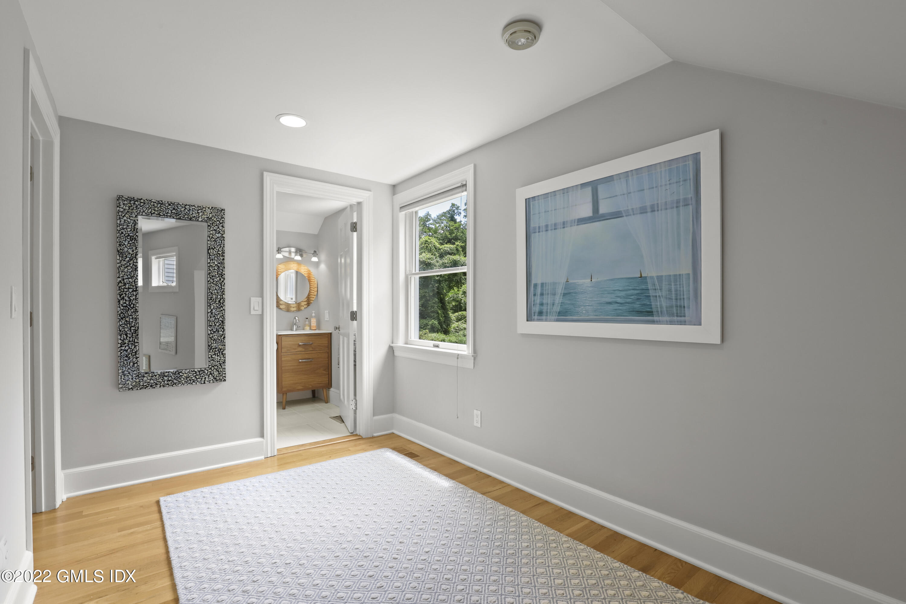4 Juniper Hill Road Greenwich, CT 06830 - Photo 33 of 54 a view of an empty room with glass door and wooden floor