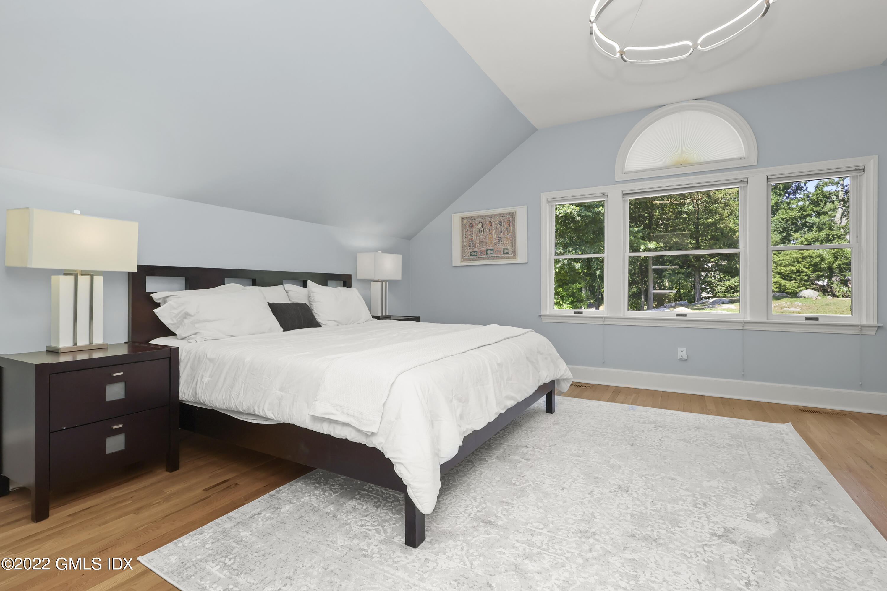 4 Juniper Hill Road Greenwich, CT 06830 - Photo 34 of 54 a spacious bedroom with a bed and a large window