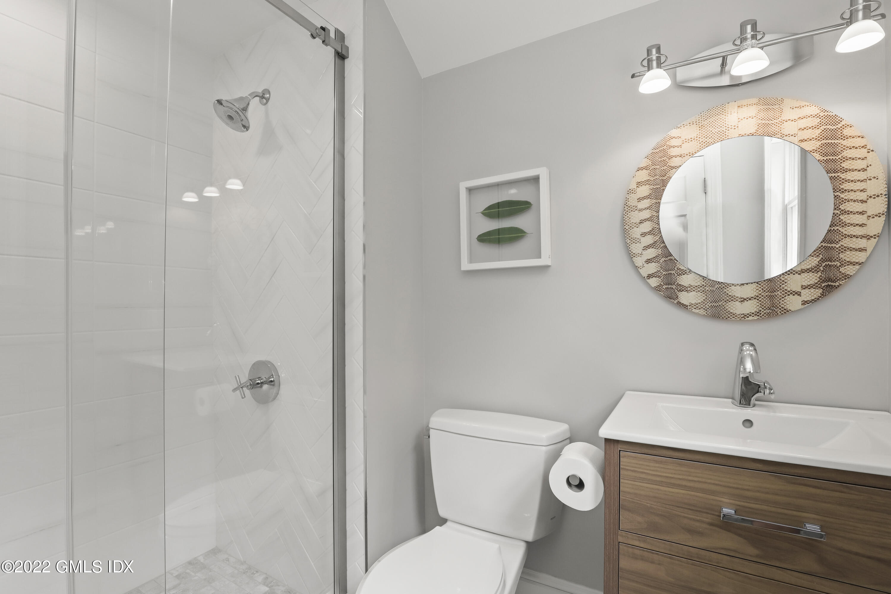 4 Juniper Hill Road Greenwich, CT 06830 - Photo 35 of 54 a bathroom with a toilet a sink and mirror