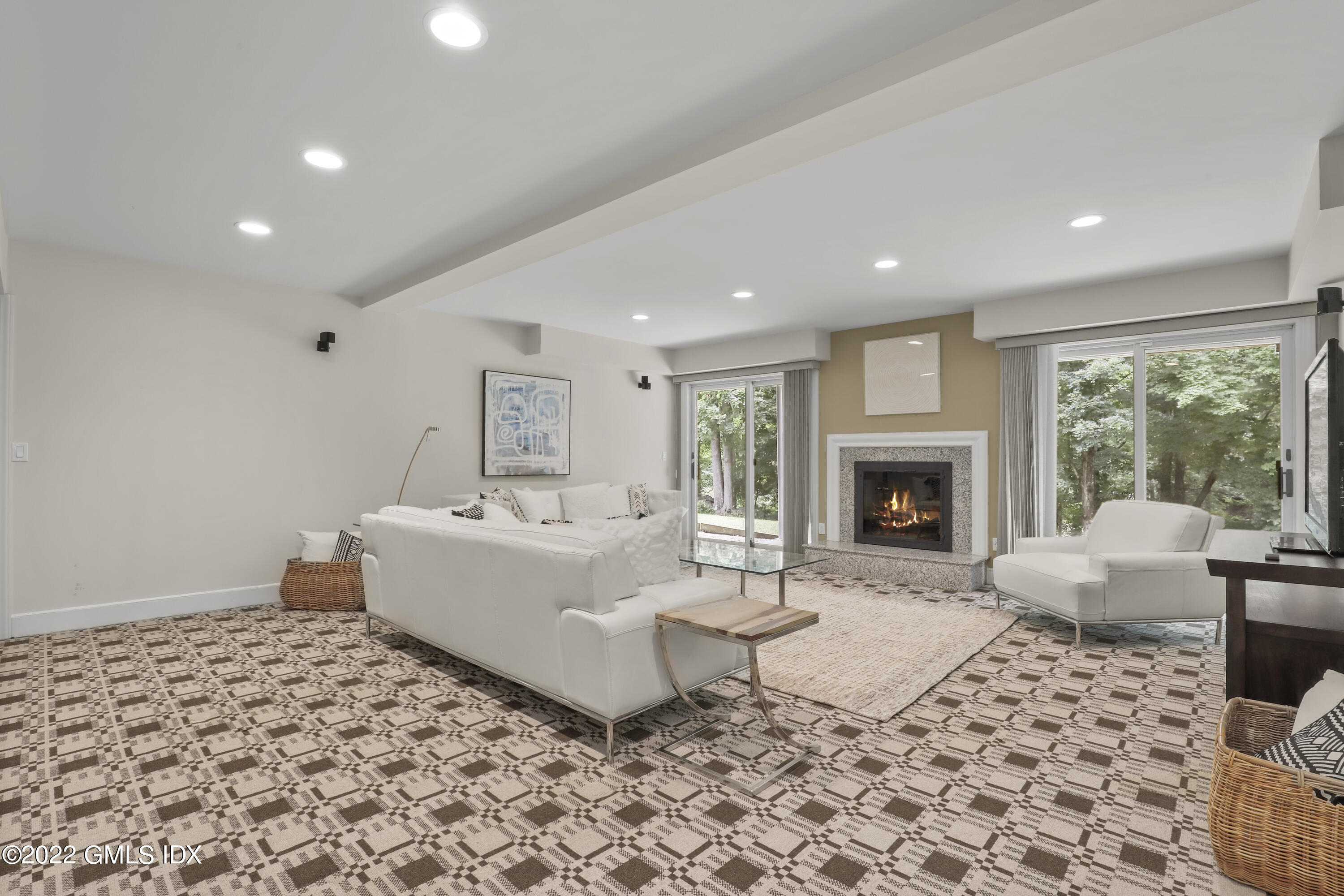 4 Juniper Hill Road Greenwich, CT 06830 - Photo 38 of 54 a living room with a couch and a fireplace