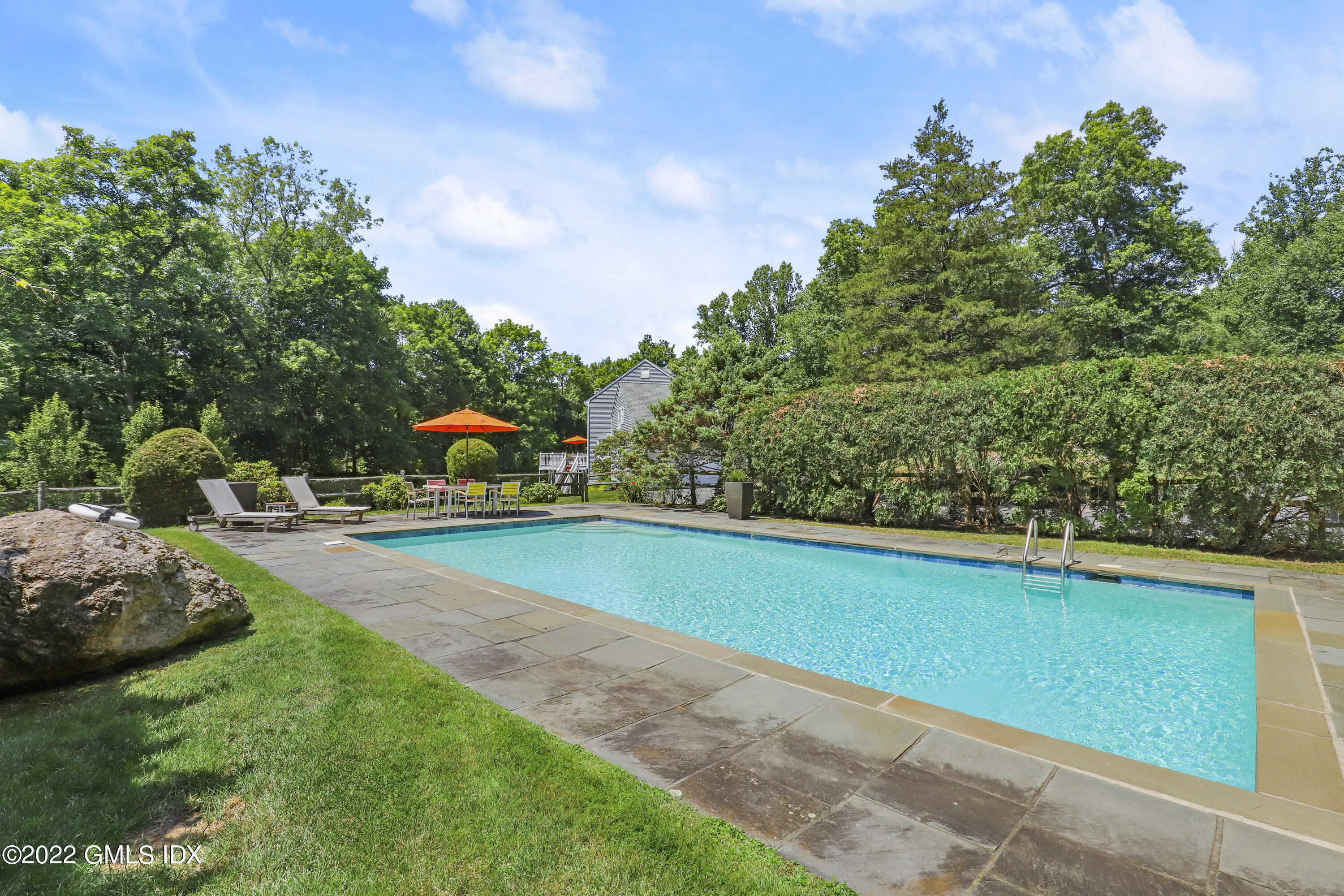 4 Juniper Hill Road Greenwich, CT 06830 - Photo 44 of 54 a green field with lots of trees in the background