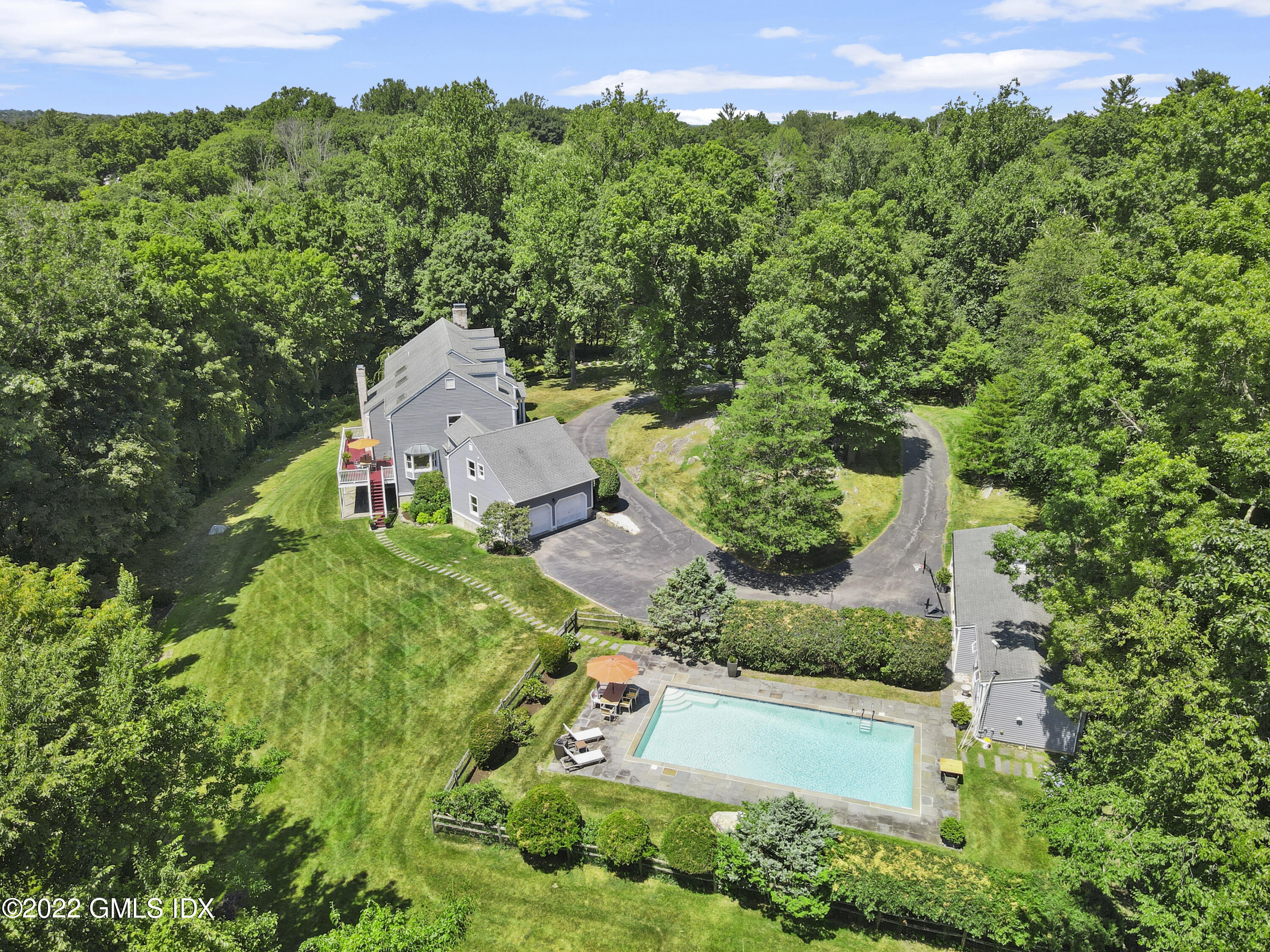 4 Juniper Hill Road Greenwich, CT 06830 - Photo 48 of 54 an aerial view of a house with yard and green space