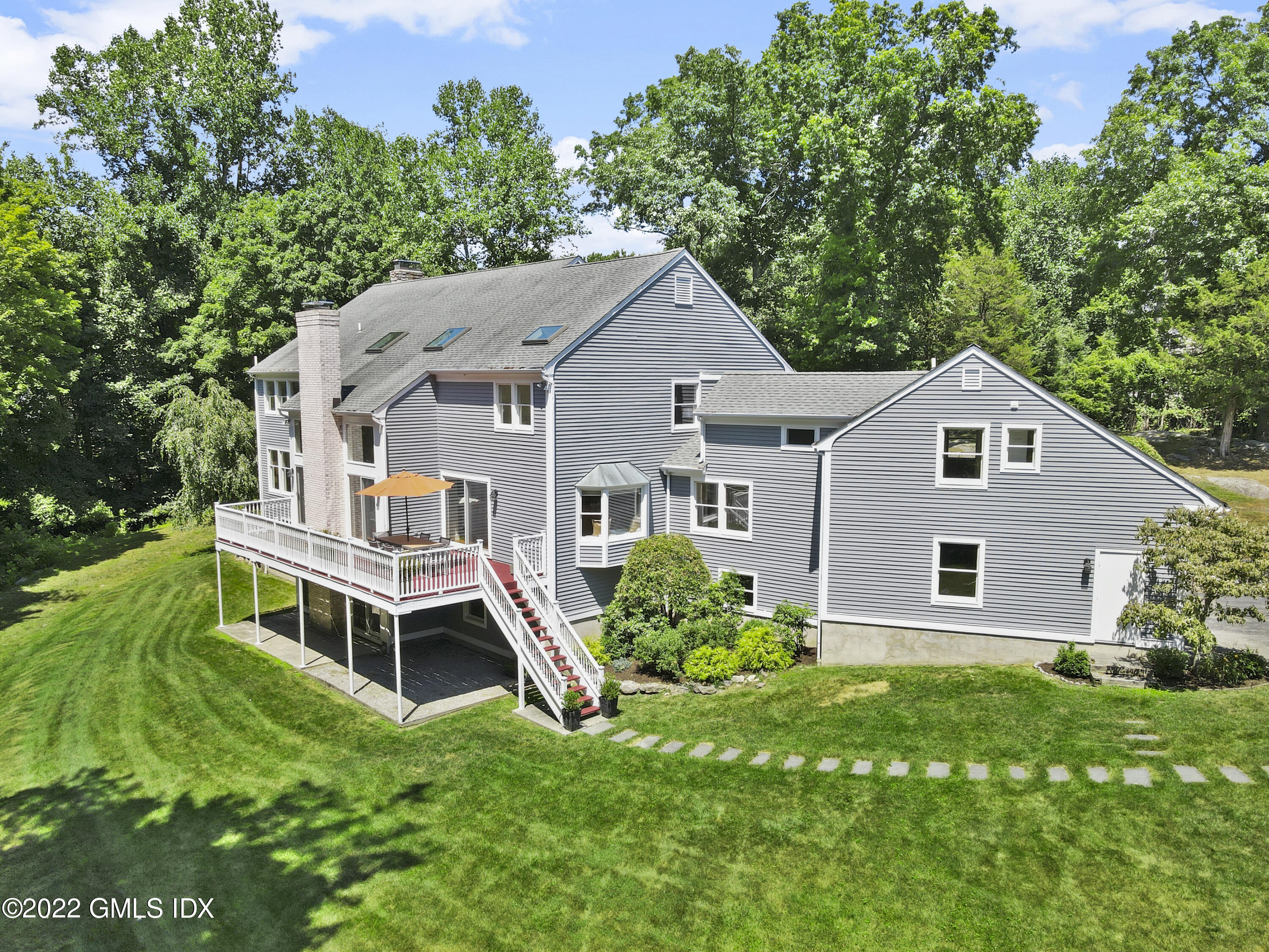 4 Juniper Hill Road Greenwich, CT 06830 - Photo 49 of 54 front view of a house with a yard