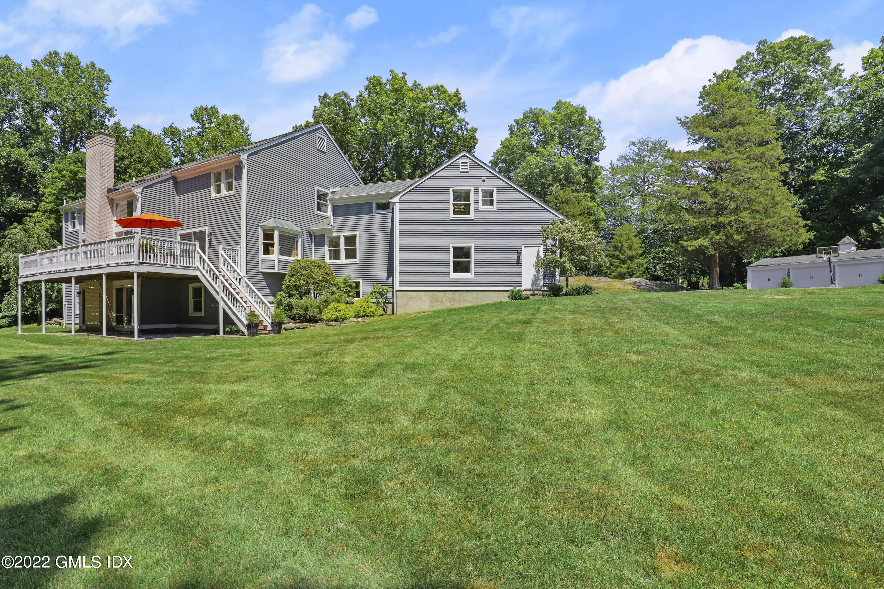 4 Juniper Hill Road Greenwich, CT 06830 - Photo 50 of 54 a front view of house with yard and green space