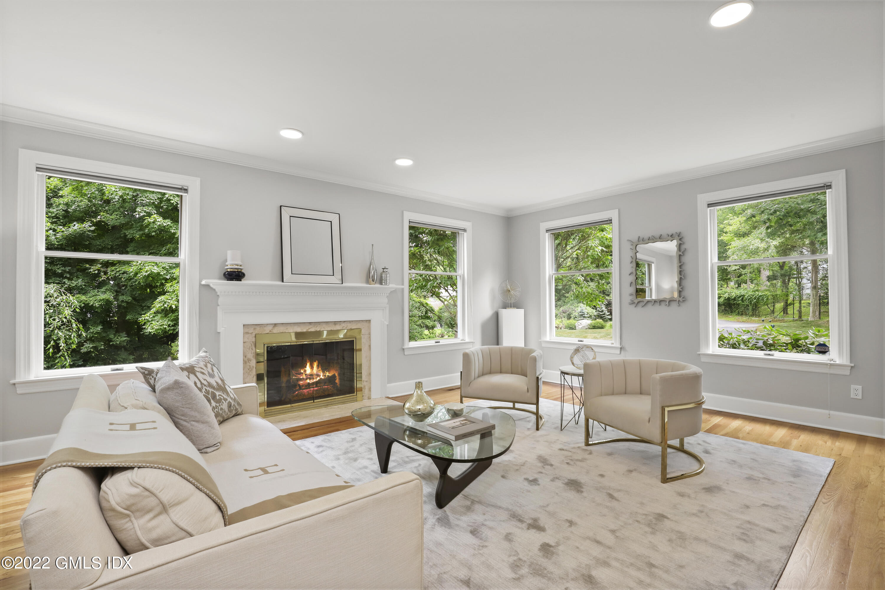 4 Juniper Hill Road Greenwich, CT 06830 - Photo 6 of 54 a living room with furniture and a fireplace