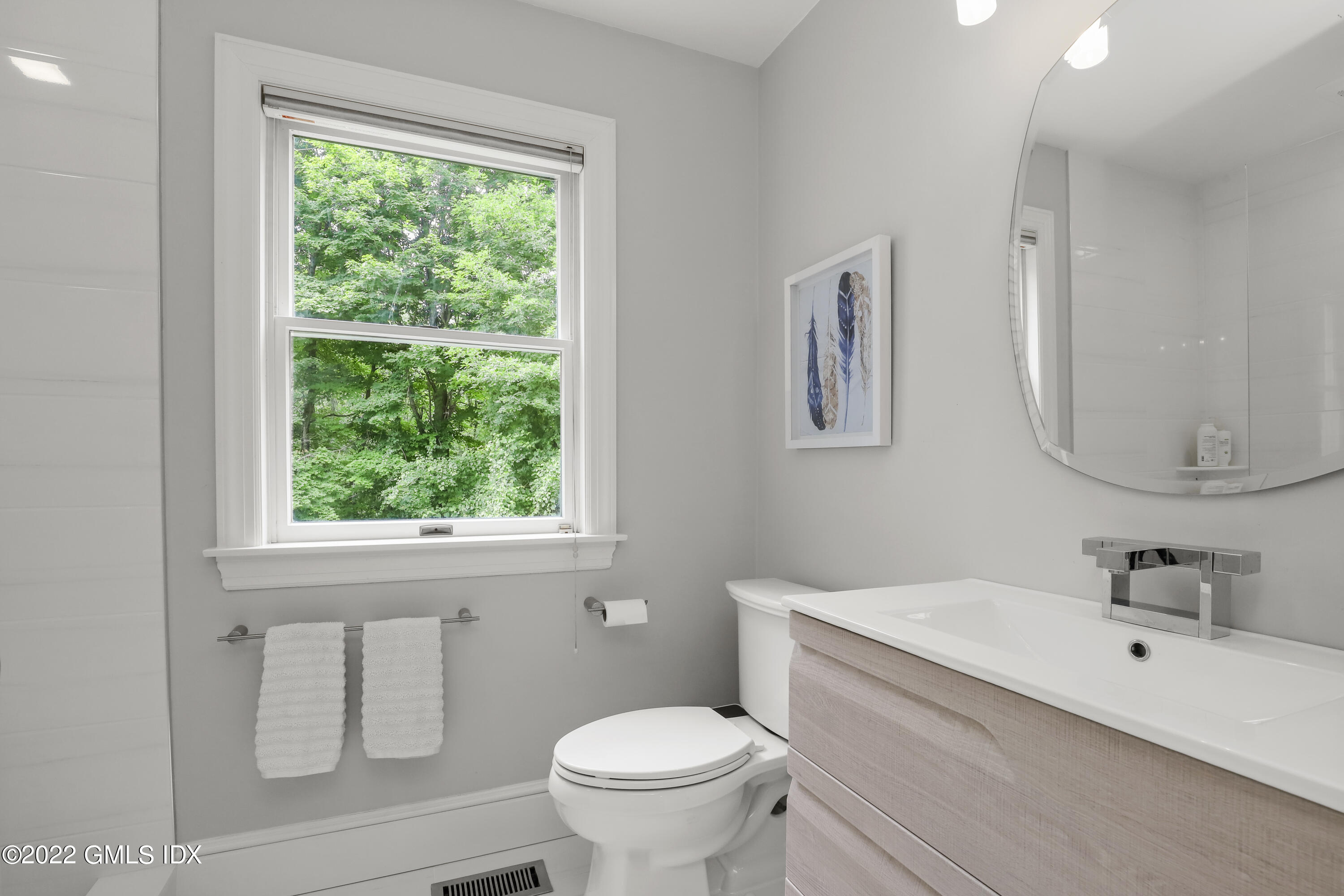 4 Juniper Hill Road Greenwich, CT 06830 - Photo 9 of 54 a bathroom with a toilet sink and mirror