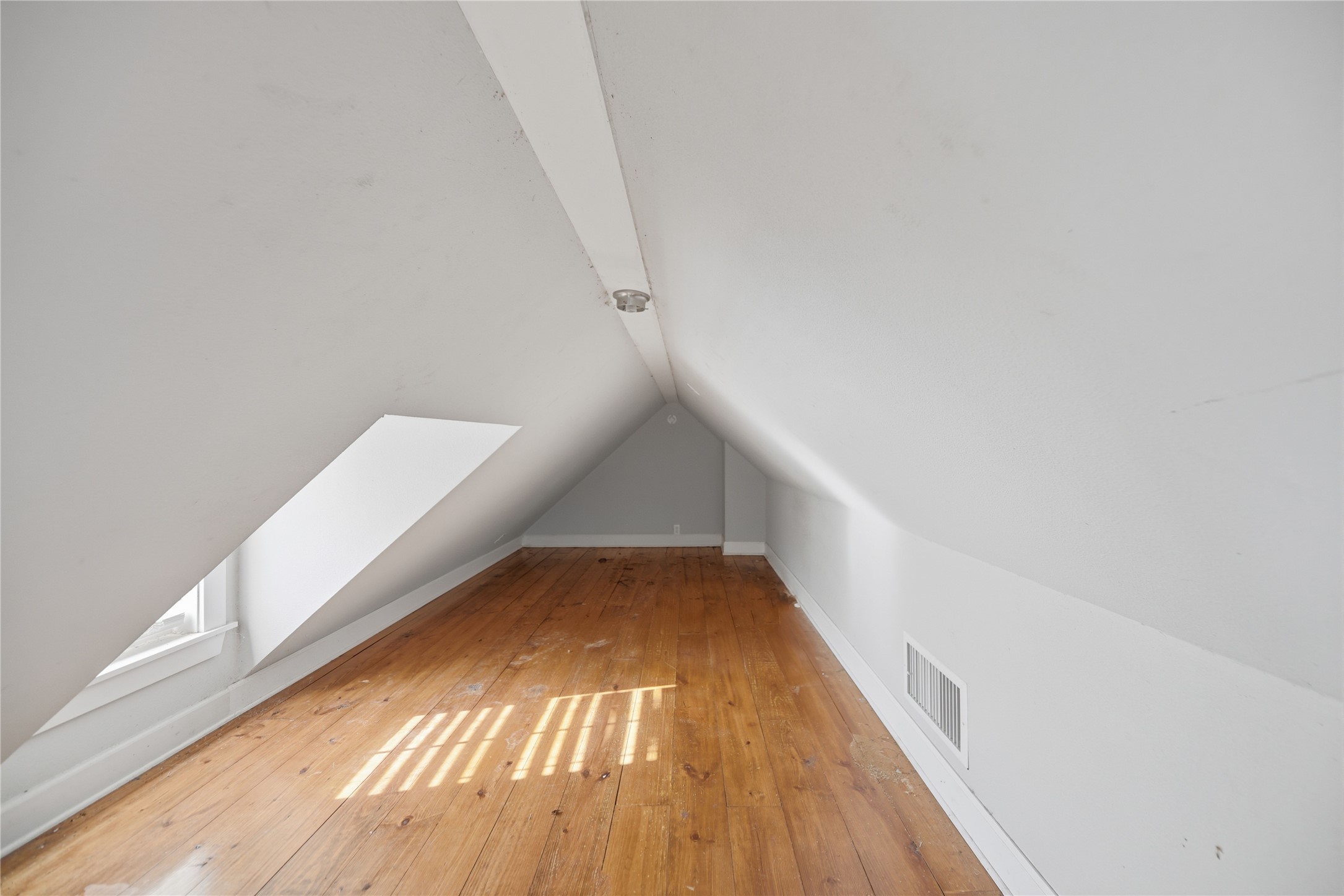 2980 Rabbs Prairie Road La Grange, TX 78945 - Photo 18 of 28 A well-lit space with gleaming hardwood floors, offering versatile possibilities.